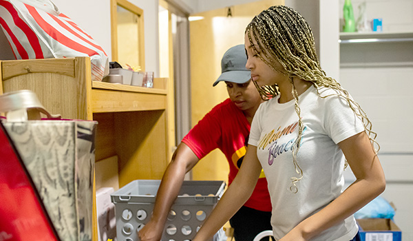 Image of students and families moving into La Salle's dorm rooms.